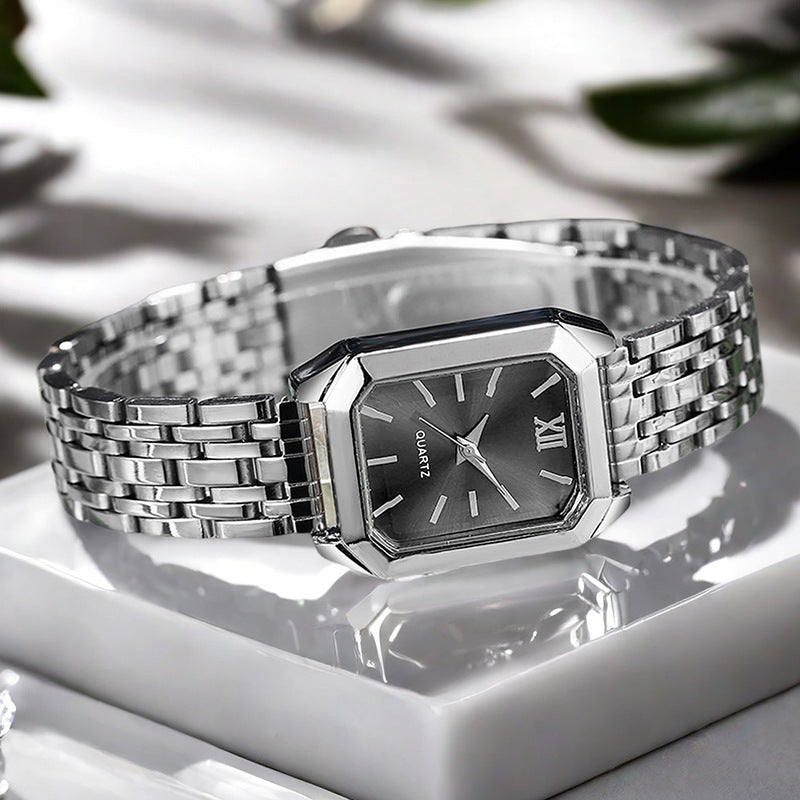 The Lady Is Just Wearing A Square Quartz Watch